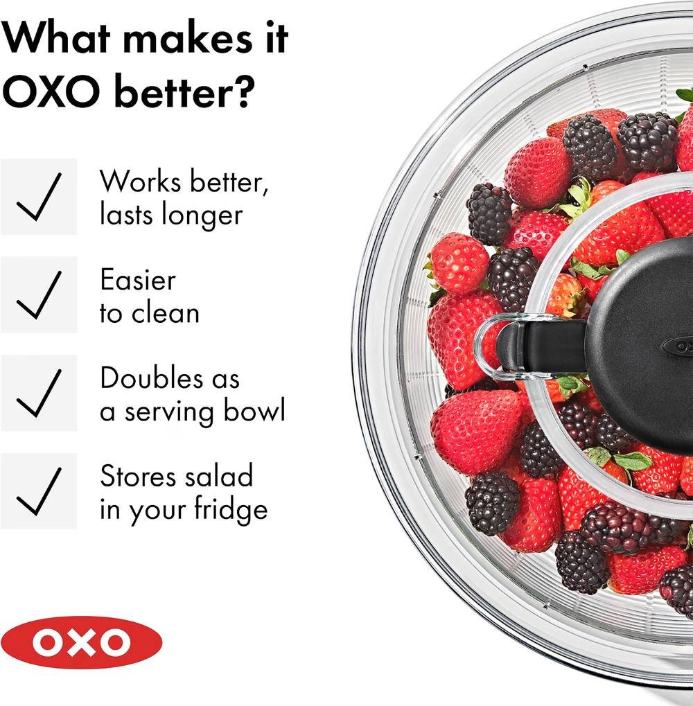 OXO salad spinner filled with strawberries and blackberries showing durability and easy cleaning benefit
