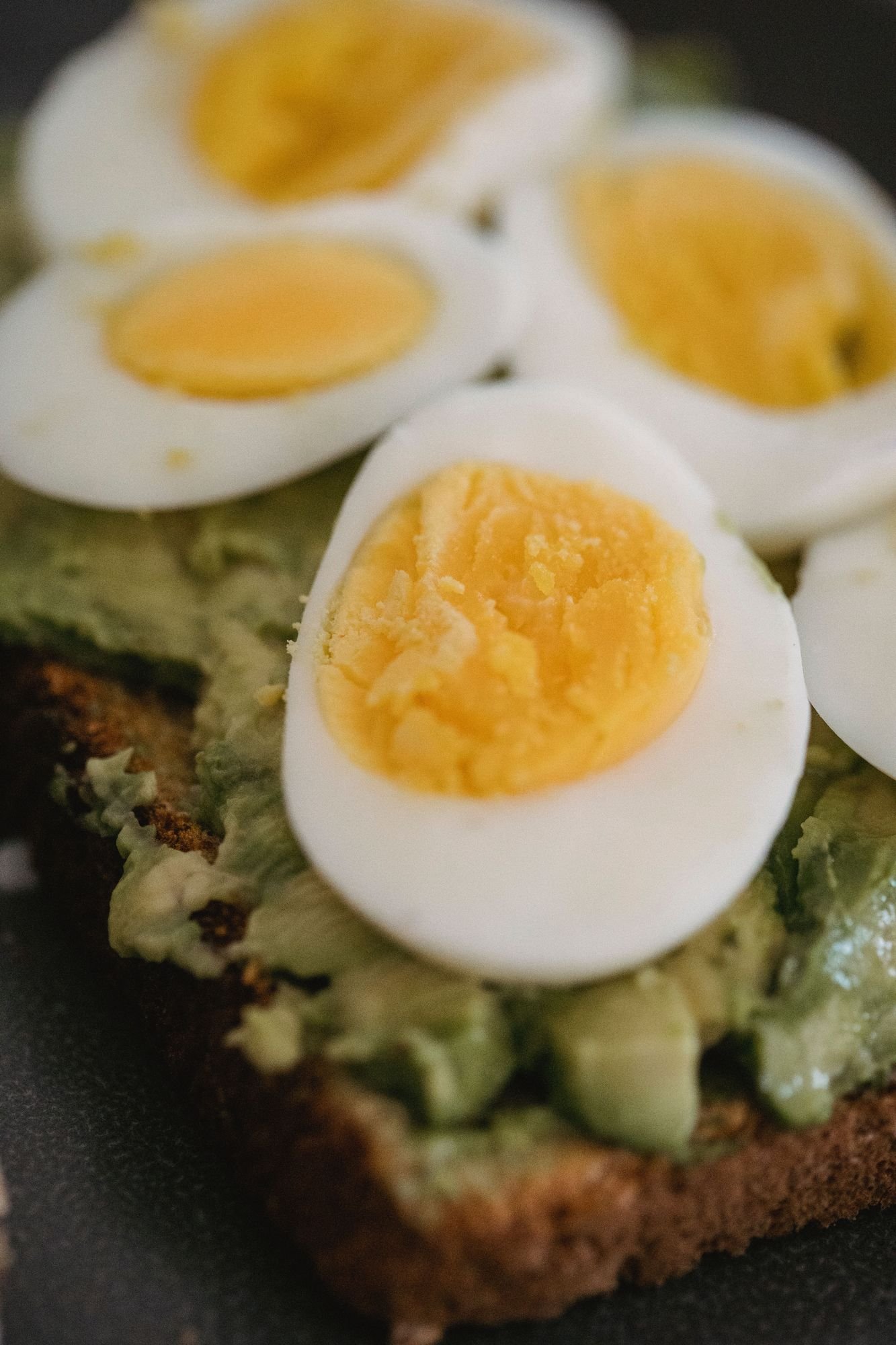 Avocado toast topped with boiled eggs for a healthy breakfast