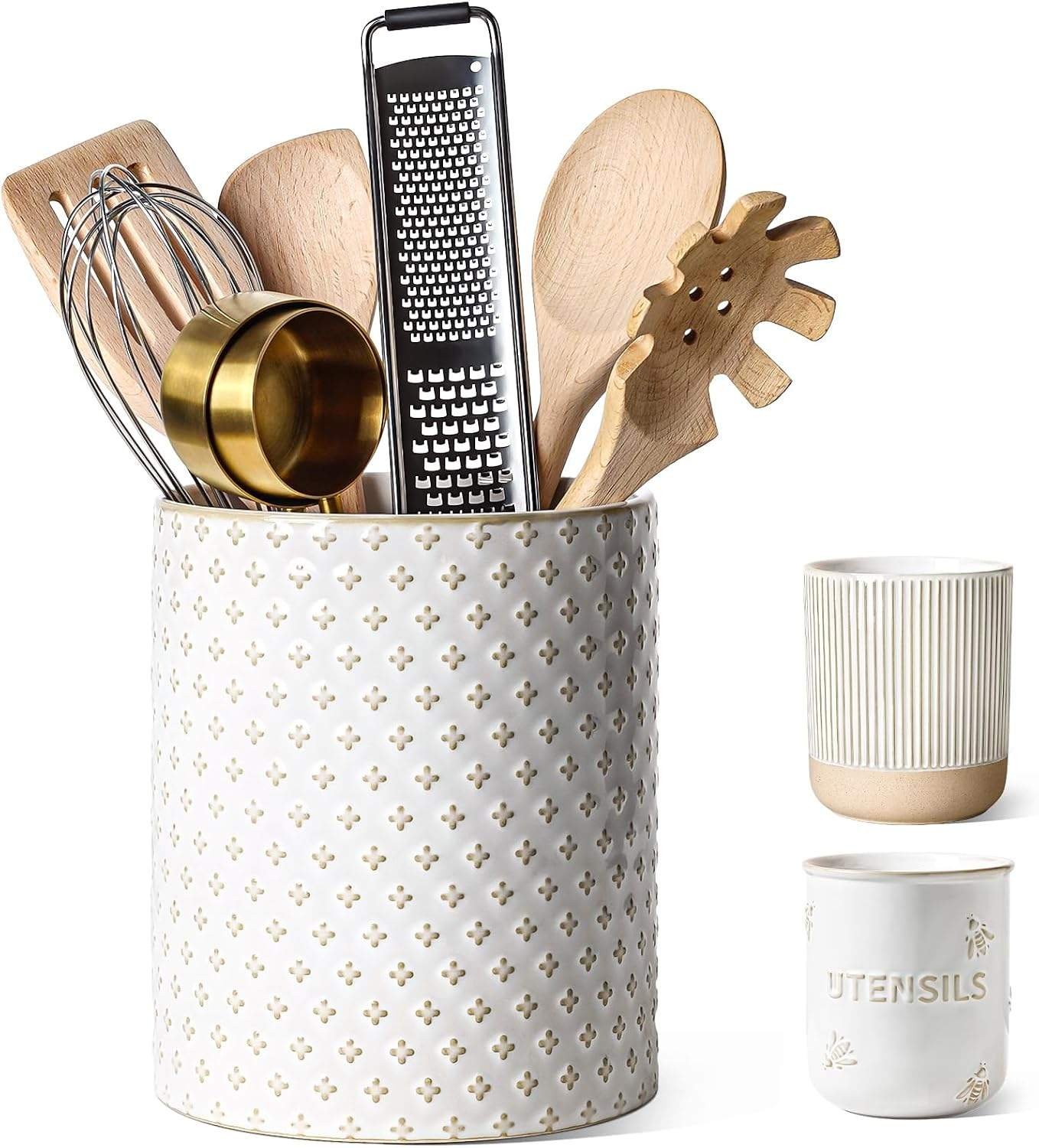 White ceramic utensil holder with embossed pattern and wooden kitchen tools